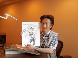 Araki holding a finished sketch for the Anime Expo presentation video (2022)
