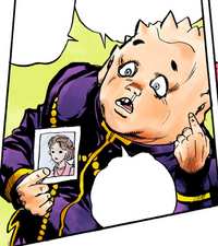 Shigechi holding a picture of his mom