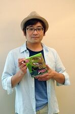 Ueda holding JoJo Blu-Ray Volume 4
