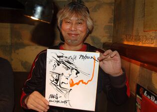 Holding a his sketch (2012)
