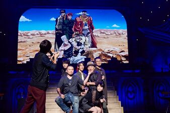 The cast replicating the photograph at the "Last Stardust Crusaders" event