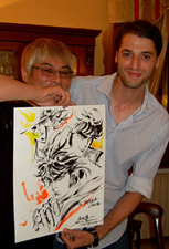 Holding sketch, being given to a fan (Sep 18, 2015)[48]