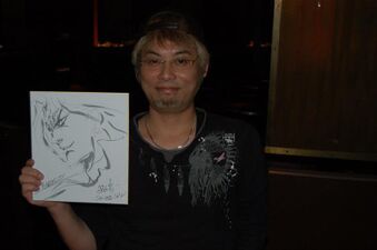 Holding his finished sketch (2012)[73]