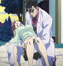 An unconscious Shinobu being held and protected by Kira.