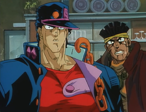 With Jotaro, in shock knowing that the dealer kid worked for D'arby all along