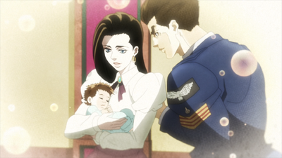 Joseph as a baby with his parents, Elizabeth Joestar and George Joestar II